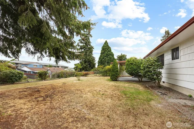 a view of a house with a outdoor space and street view