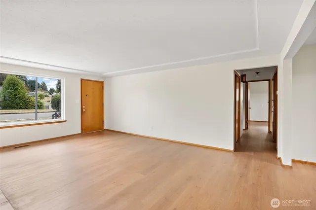 a view of an empty room with a window