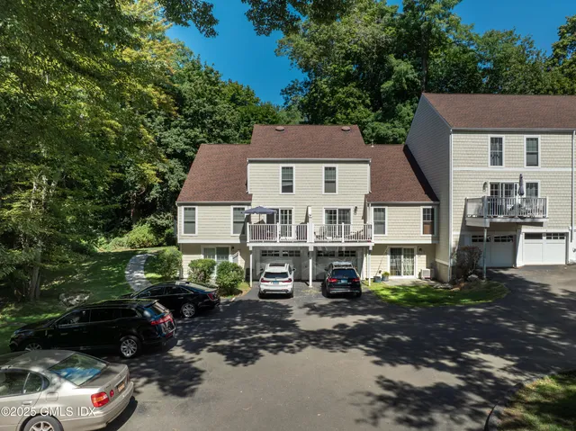 a view of a car park in front of house