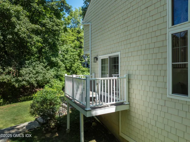 a view of a chair and table in the balcony