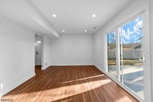 a bathroom with a sink vanity mirror and toilet