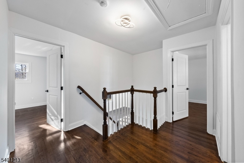 14 Harwich Road Flanders, NJ 07836 - Photo 15 of 34 a view of a hallway with wooden floor and stairs