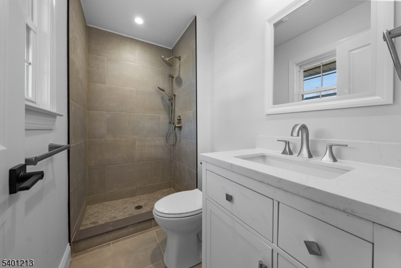 14 Harwich Road Flanders, NJ 07836 - Photo 18 of 34 a bathroom with a sink a toilet and shower