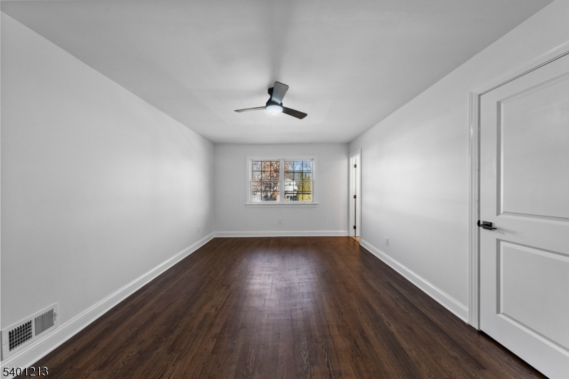 14 Harwich Road Flanders, NJ 07836 - Photo 21 of 34 an empty room with wooden floor chandelier and windows
