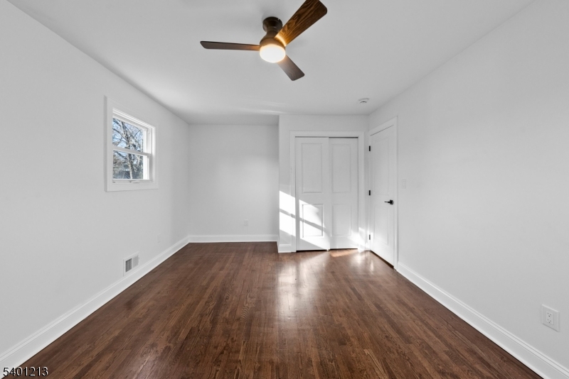 14 Harwich Road Flanders, NJ 07836 - Photo 23 of 34 an empty room with wooden floor ceiling fan and window