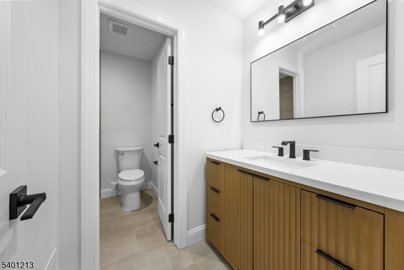 14 Harwich Road Flanders, NJ 07836 - Photo 28 of 34 a bathroom with a sink a toilet and a mirror