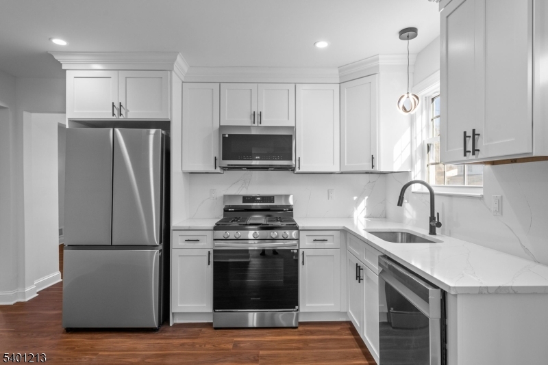 14 Harwich Road Flanders, NJ 07836 - Photo 7 of 34 a kitchen with stainless steel appliances a stove a sink a refrigerator and a microwave