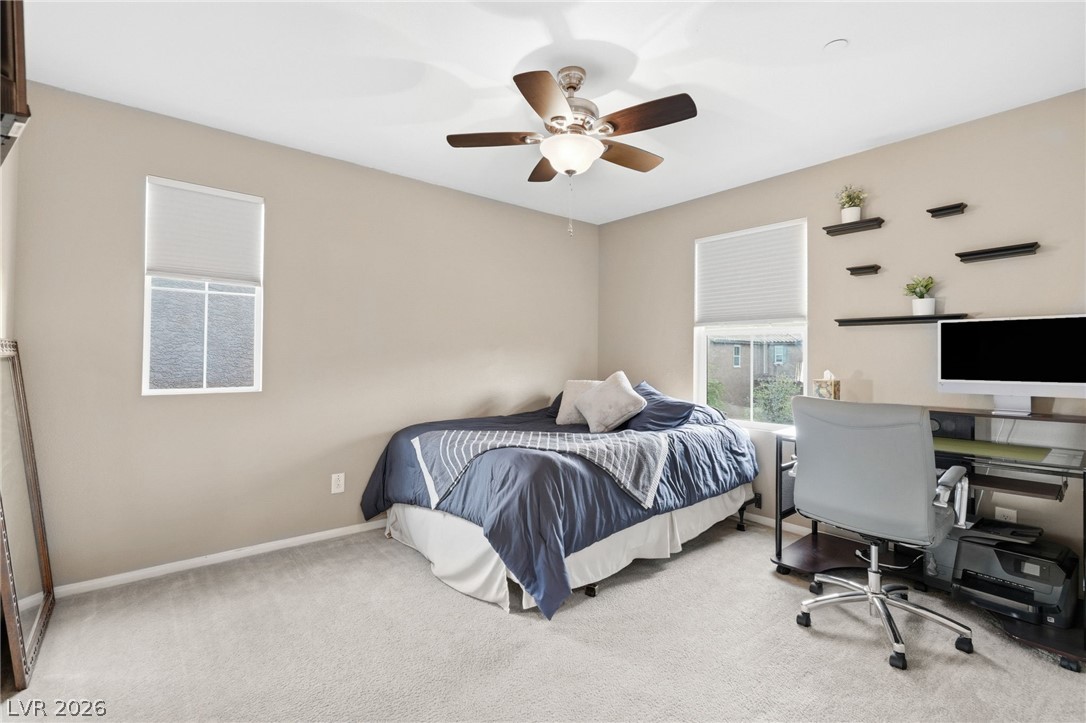 150 Fulgora Street Henderson, NV 89074 - Photo 51 of 92 Bedroom with light colored carpet, an office area, and ceiling fan