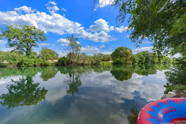a view of a lake with a street