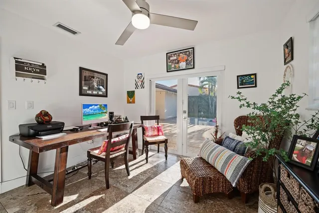 a bathroom with a granite countertop sink and a large mirror