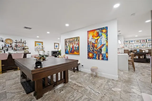 a view of a living room and dining room