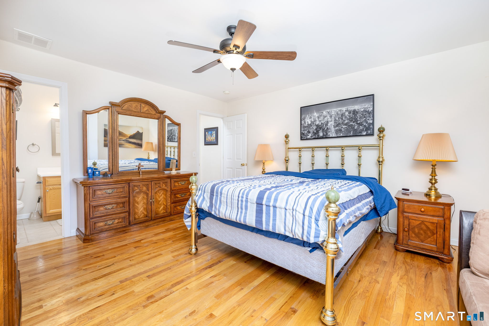 240 Wesley Street, Unit 4 Waterbury, CT 06708 - Photo 12 of 30 a bedroom with a bed and dresser with mirror