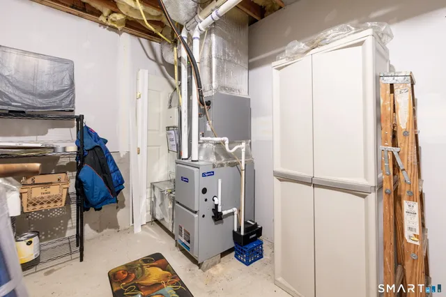 a bathroom with a sink and mirror with bathtub