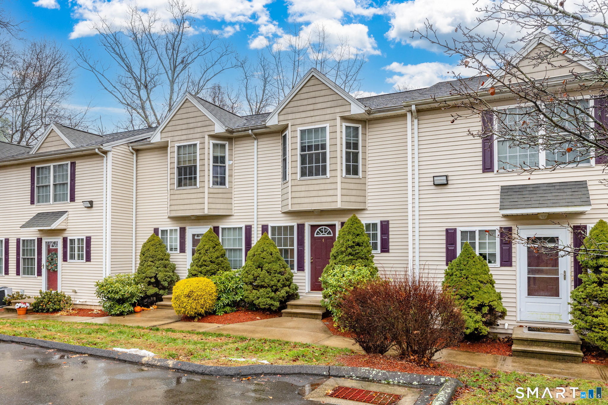 240 Wesley Street, Unit 4 Waterbury, CT 06708 - Photo 25 of 30 a front view of a house with a yard