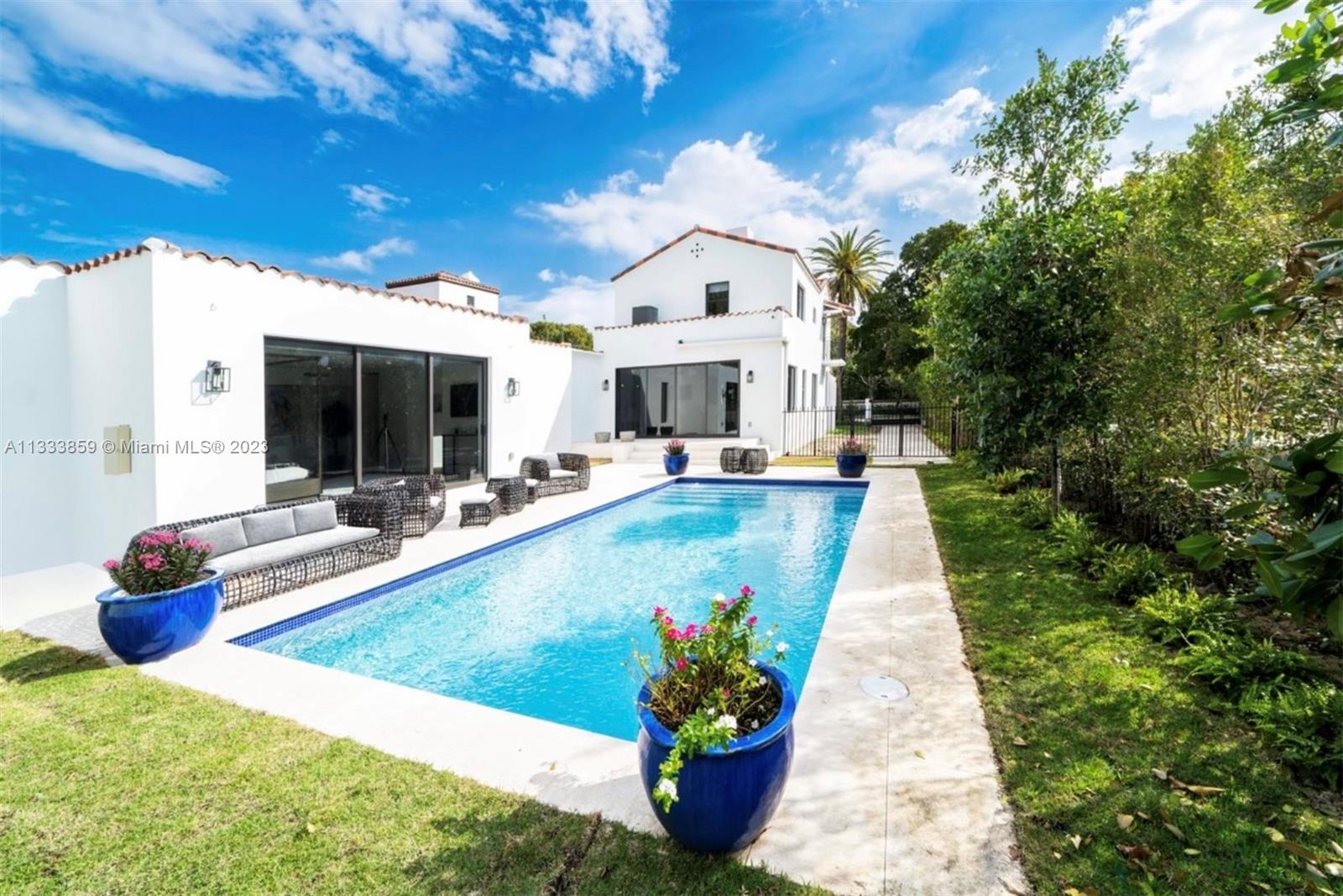 a view of swimming pool with outdoor seating