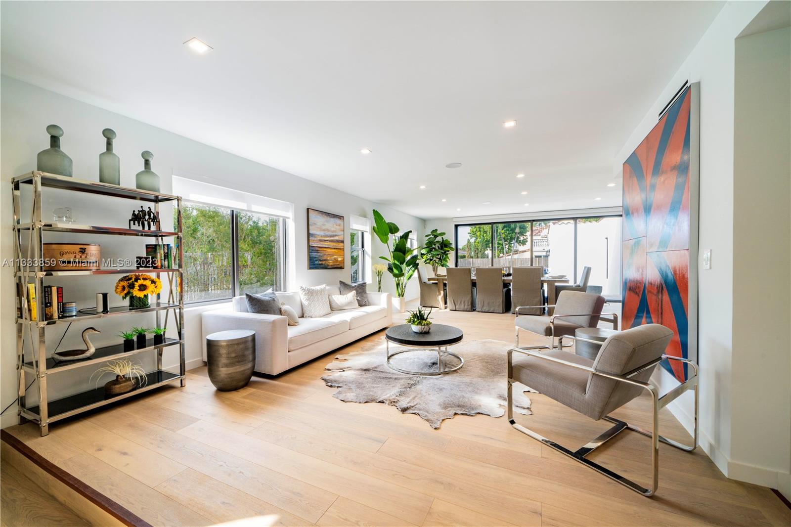 5334 Pine Tree Drive Miami Beach, FL 33140 - Photo 11 of 42 a living room with furniture and a large window