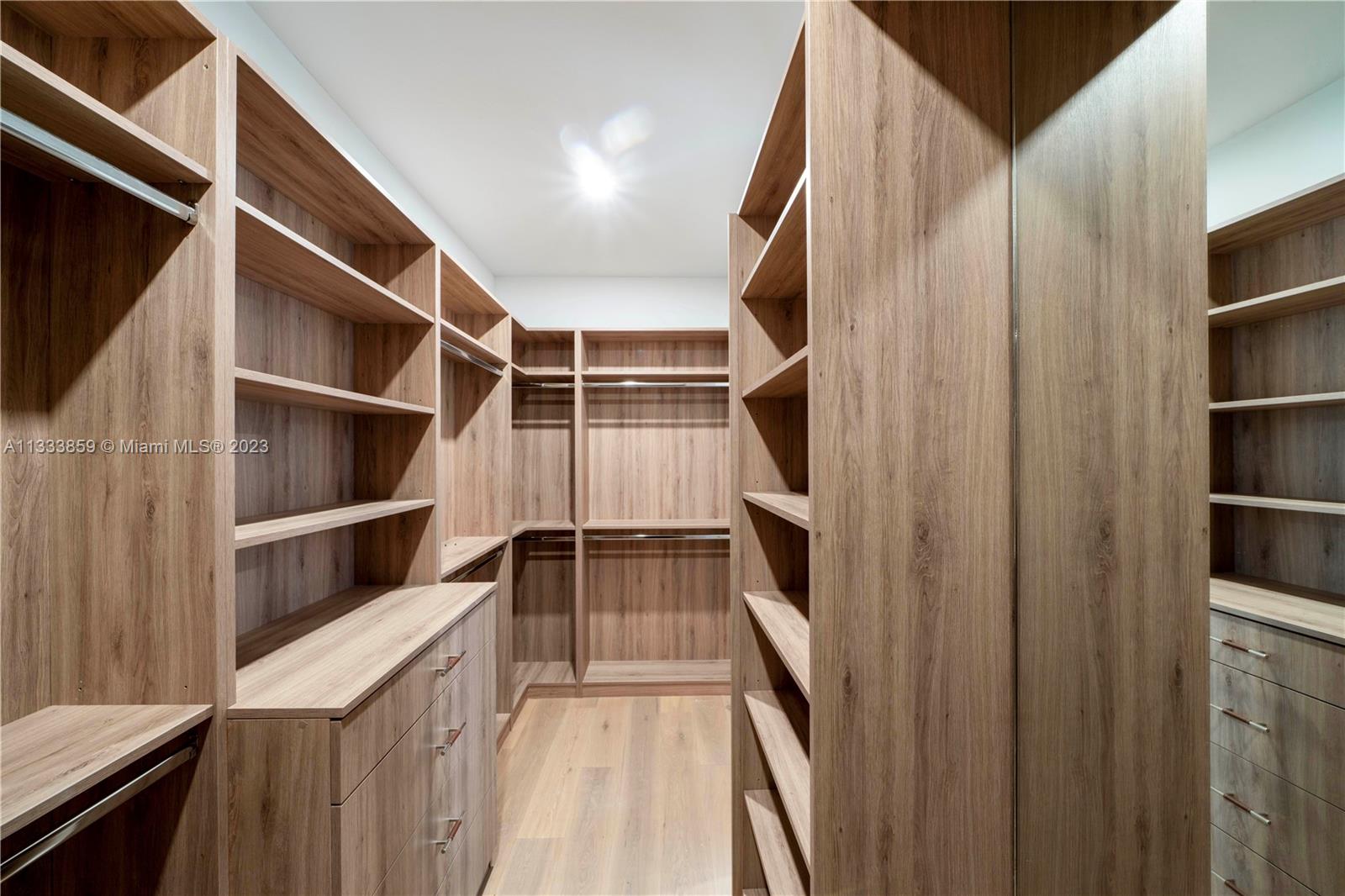 5334 Pine Tree Drive Miami Beach, FL 33140 - Photo 19 of 42 a view of walk in closet