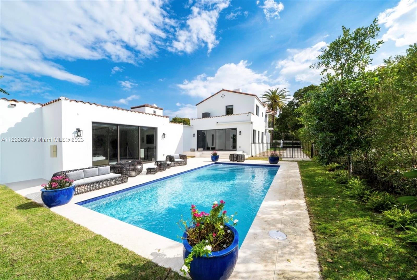 5334 Pine Tree Drive Miami Beach, FL 33140 - Photo 20 of 42 a view of a house with sitting area and garden view
