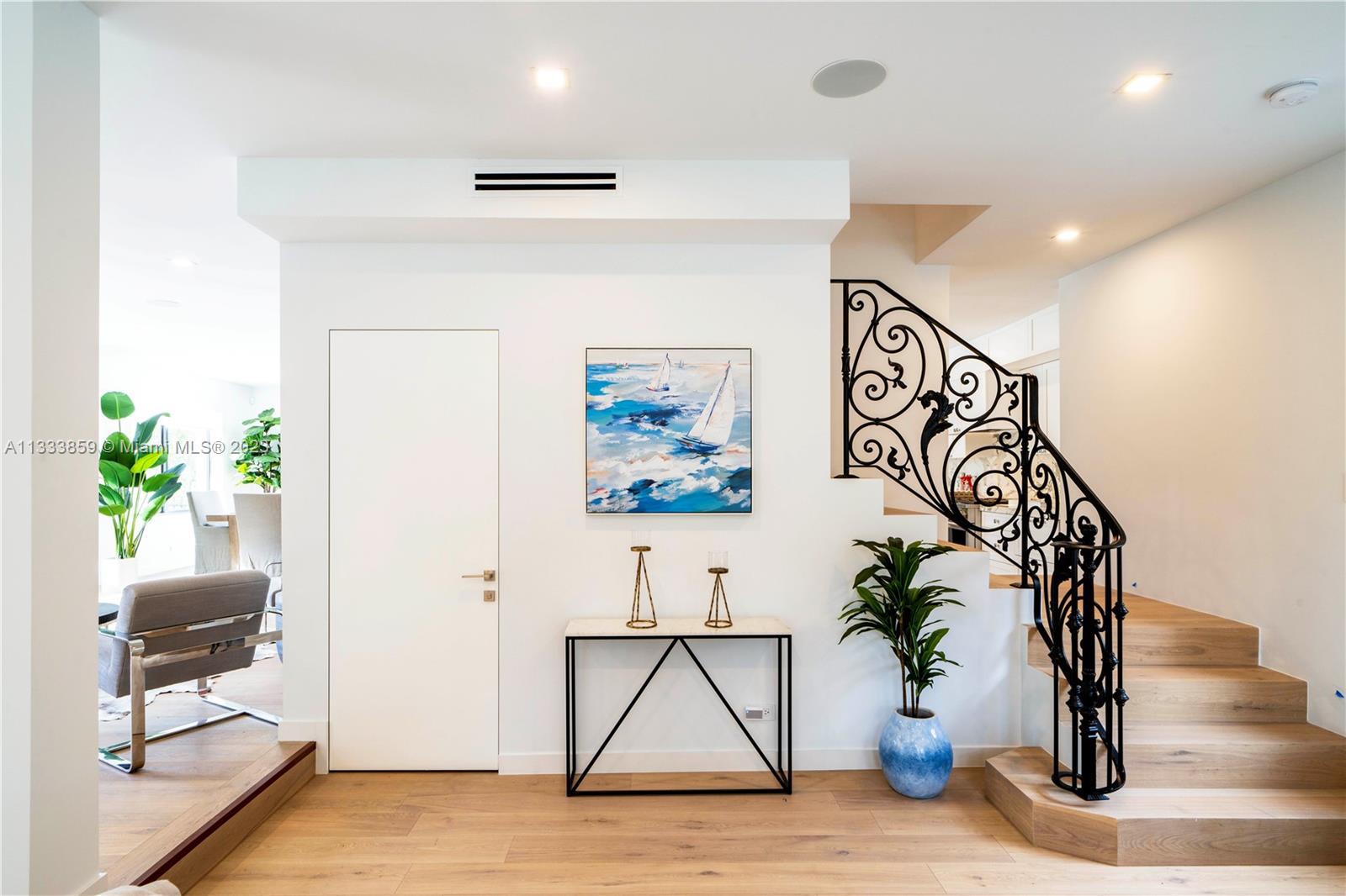 5334 Pine Tree Drive Miami Beach, FL 33140 - Photo 23 of 42 a view of entryway and hall with a potted plant