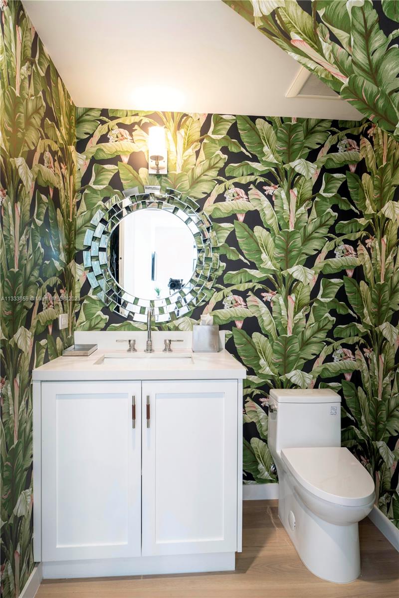 5334 Pine Tree Drive Miami Beach, FL 33140 - Photo 25 of 42 a bathroom with a sink and a toilet