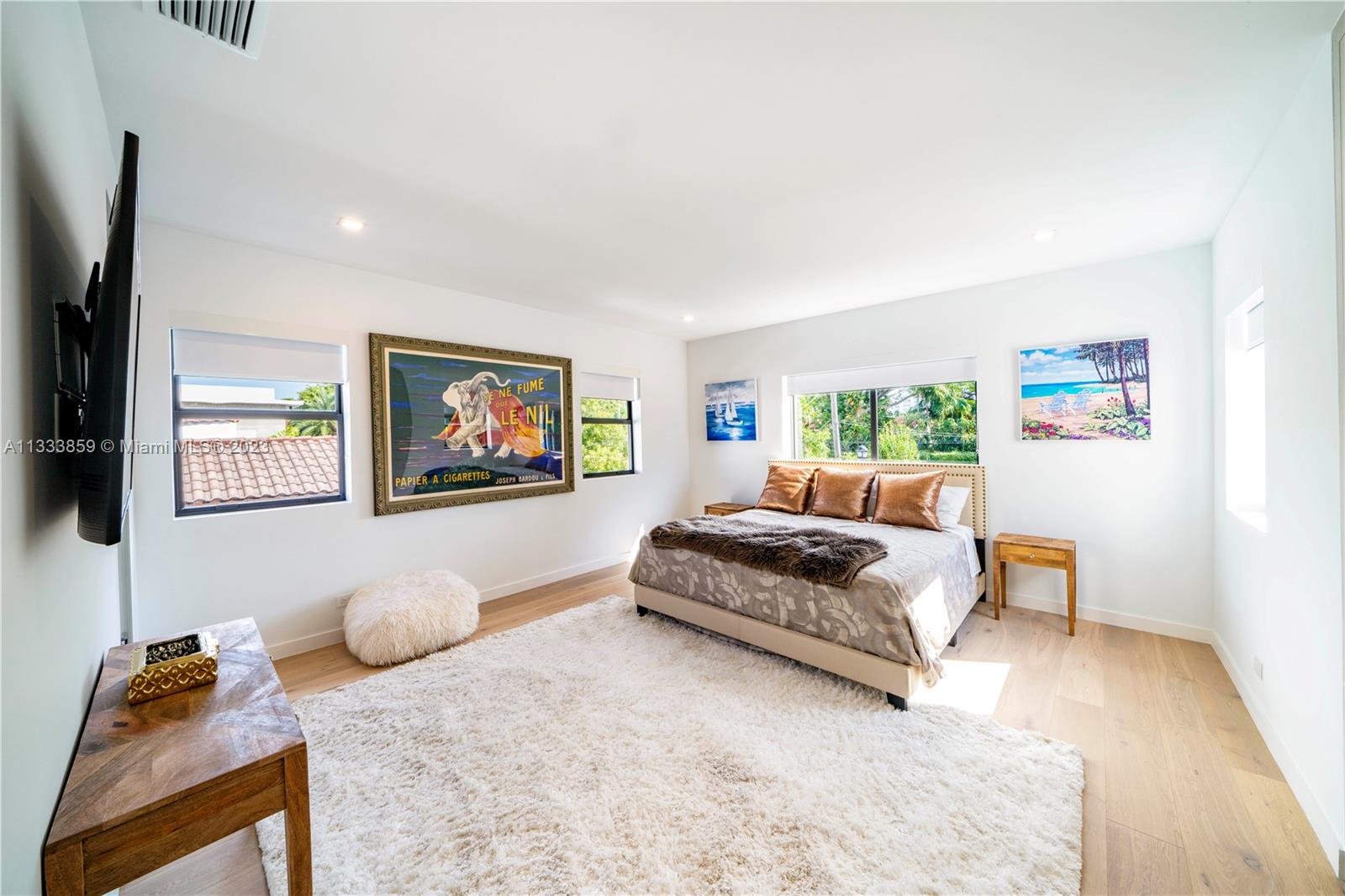 5334 Pine Tree Drive Miami Beach, FL 33140 - Photo 29 of 42 a bedroom with furniture and a bed