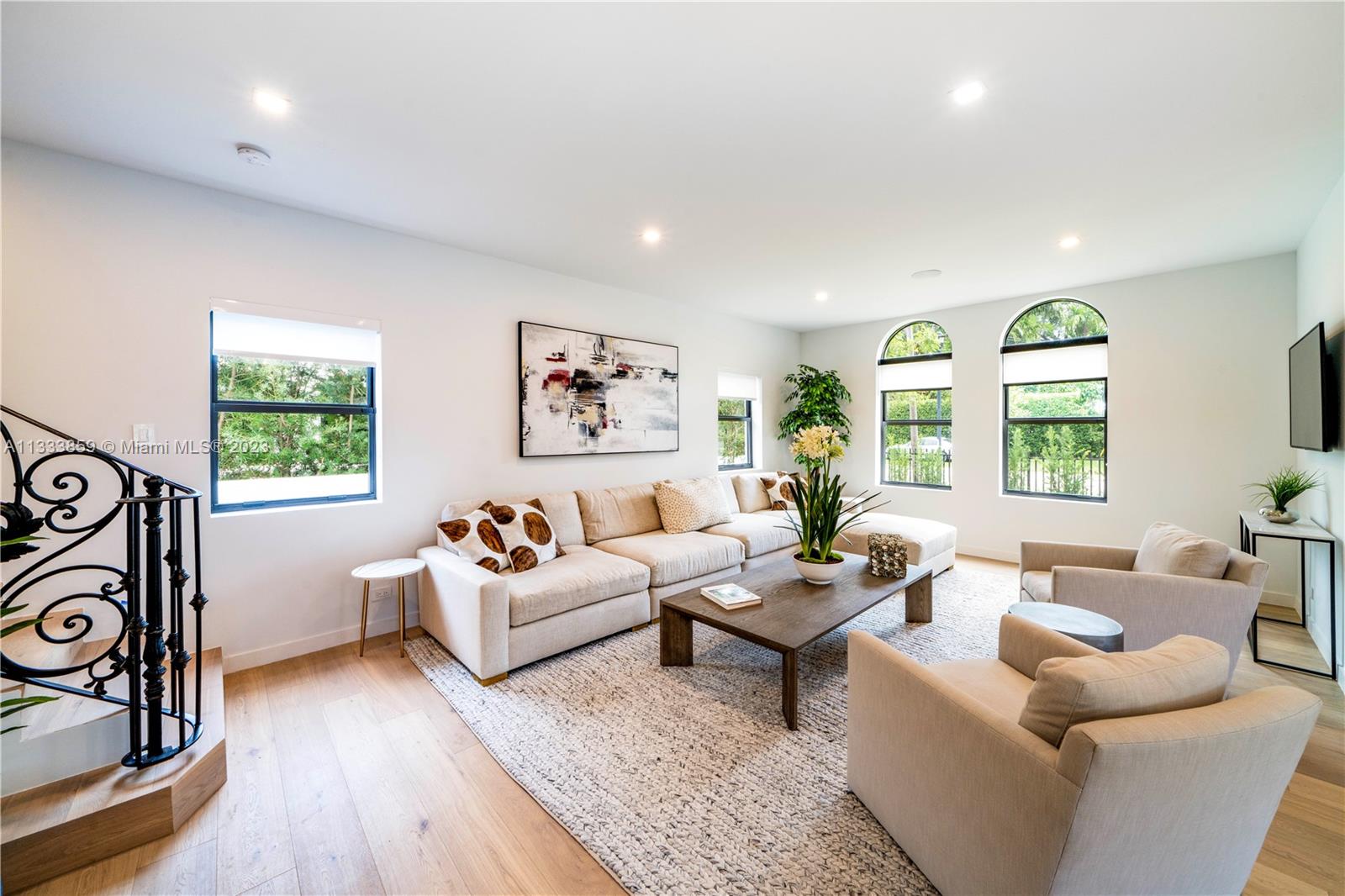 5334 Pine Tree Drive Miami Beach, FL 33140 - Photo 4 of 42 a living room with furniture and a large window