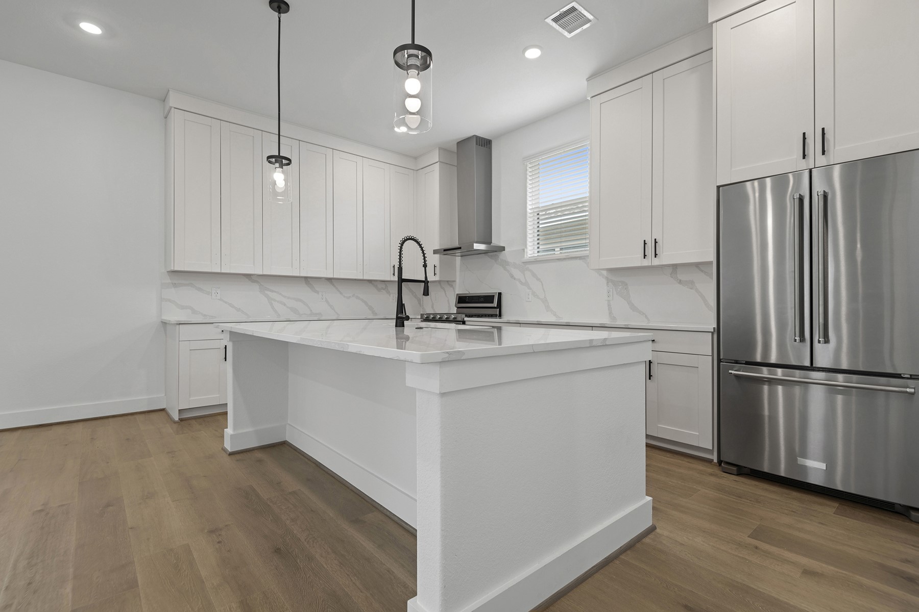 1911 Drover Lane Rosenberg, TX 77471 - Photo 12 of 22 a kitchen with kitchen island a sink appliances and cabinets