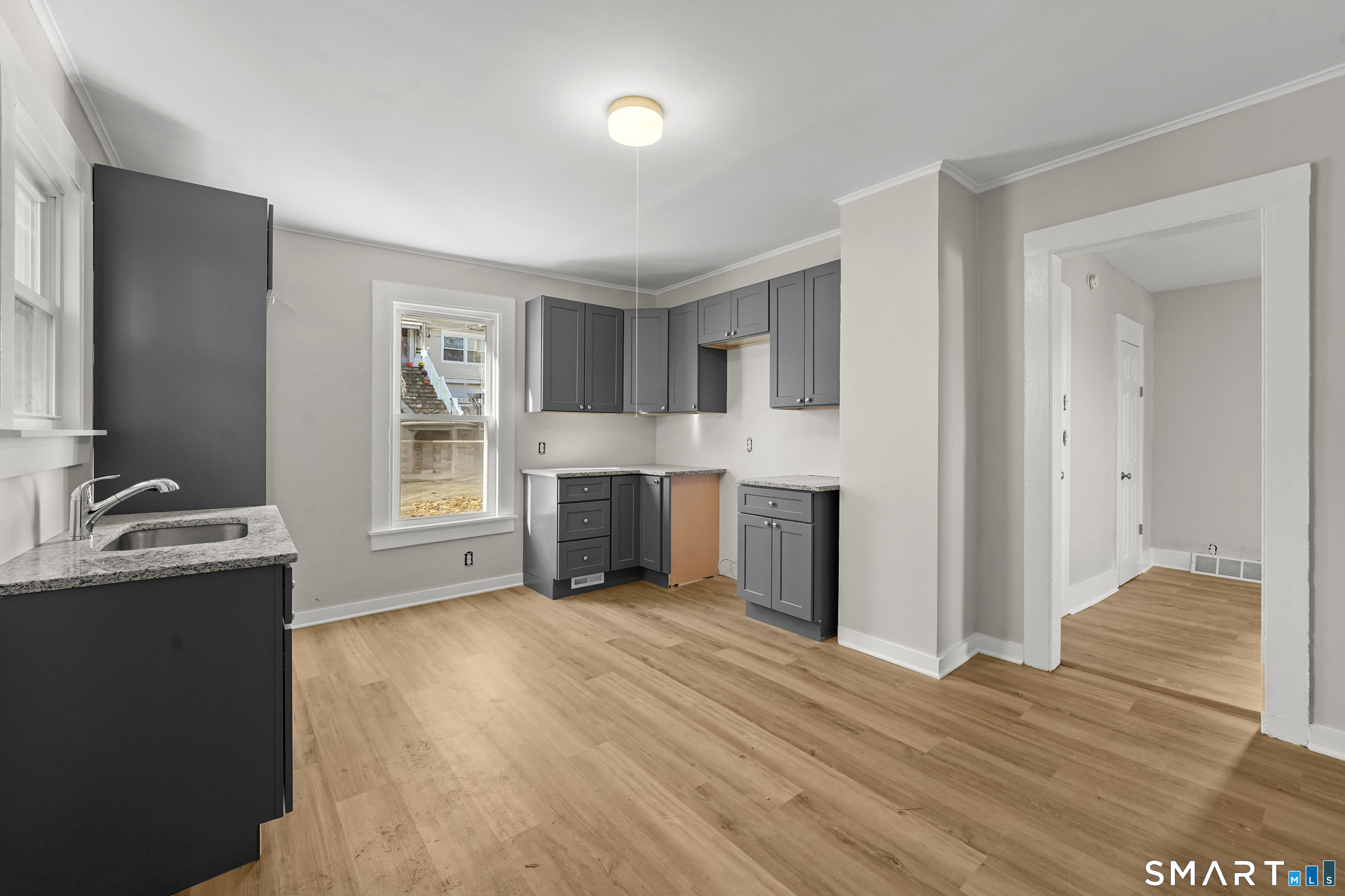45 New Street, Unit A Shelton, CT 06484 - Photo 1 of 1 a view of a kitchen with a sink a refrigerator and window