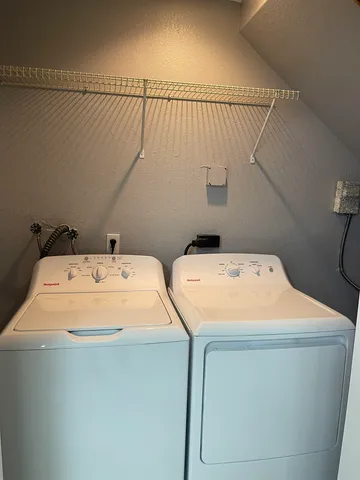 a utility room with dryer and washer