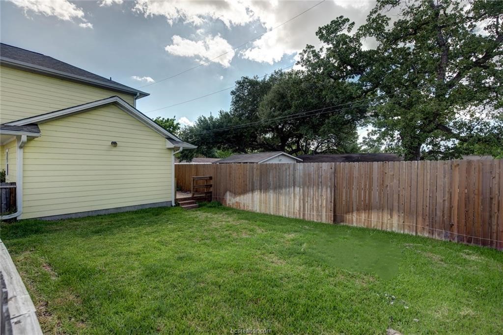 114 Lynn Drive Bryan, TX 77801 - Photo 27 of 31 a view of a backyard with a cabin