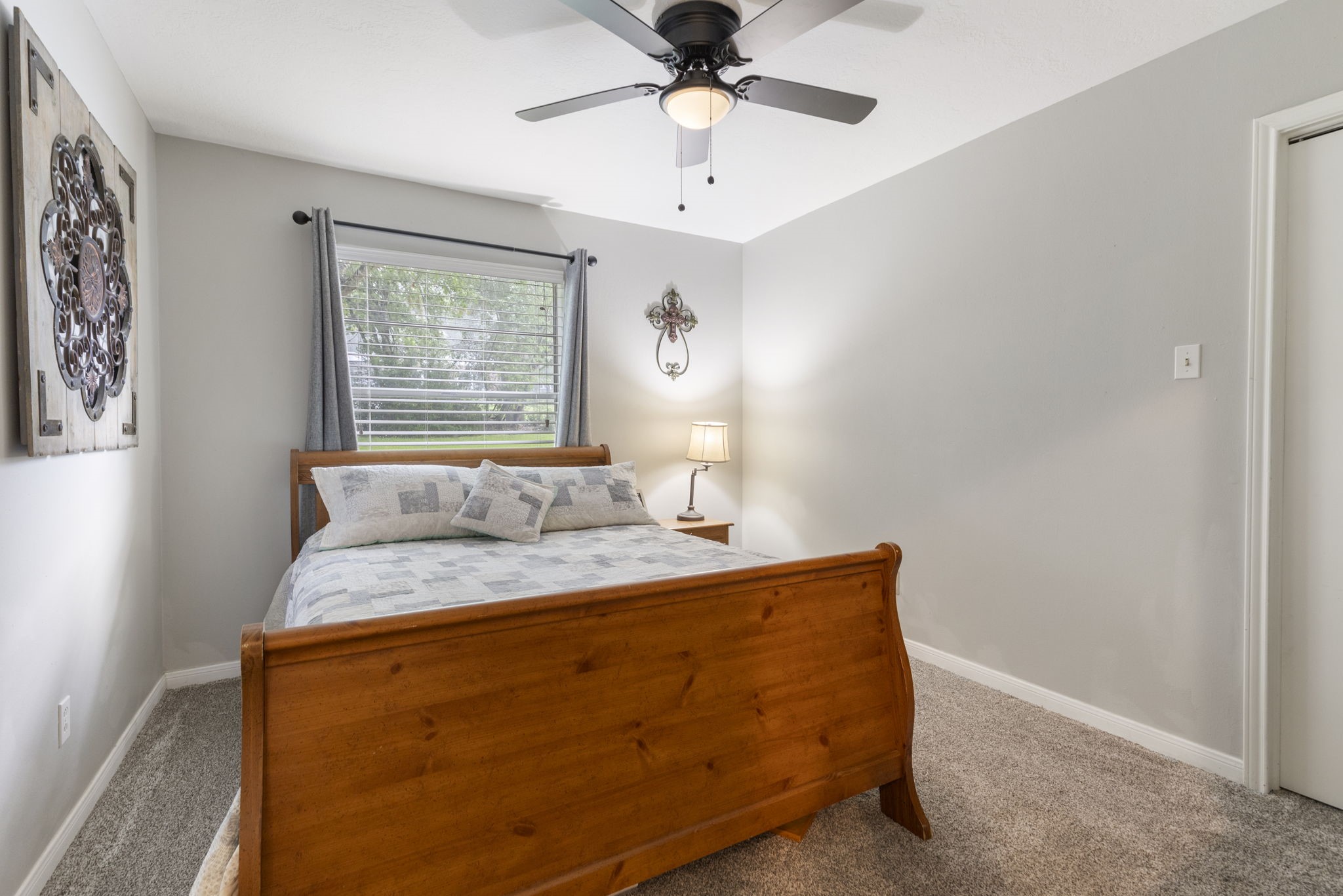 245 Lakeland Road Huntsville, TX 77320 - Photo 29 of 49 Secondary bedroom features plush carpet, and ceiling fan for added comfort