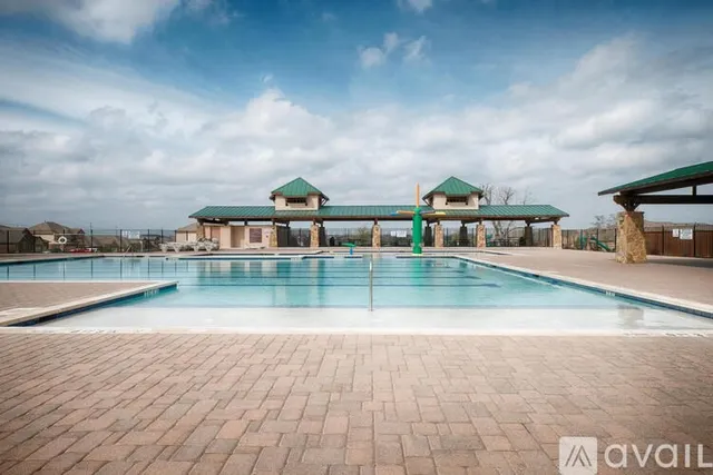 a view of building with river in front of it