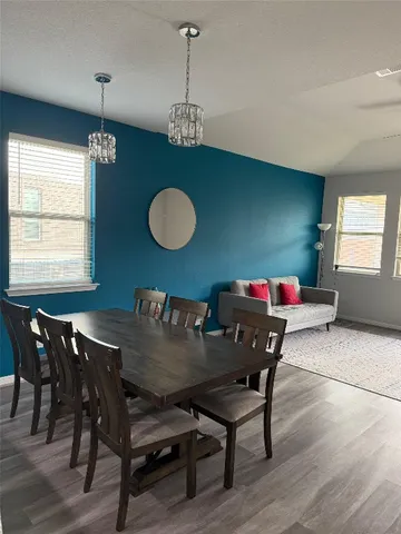 a living room with furniture and window
