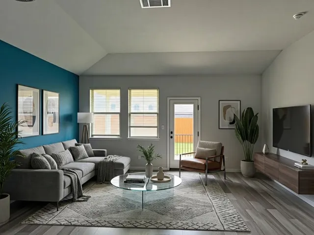 a living room with furniture and a flat screen tv