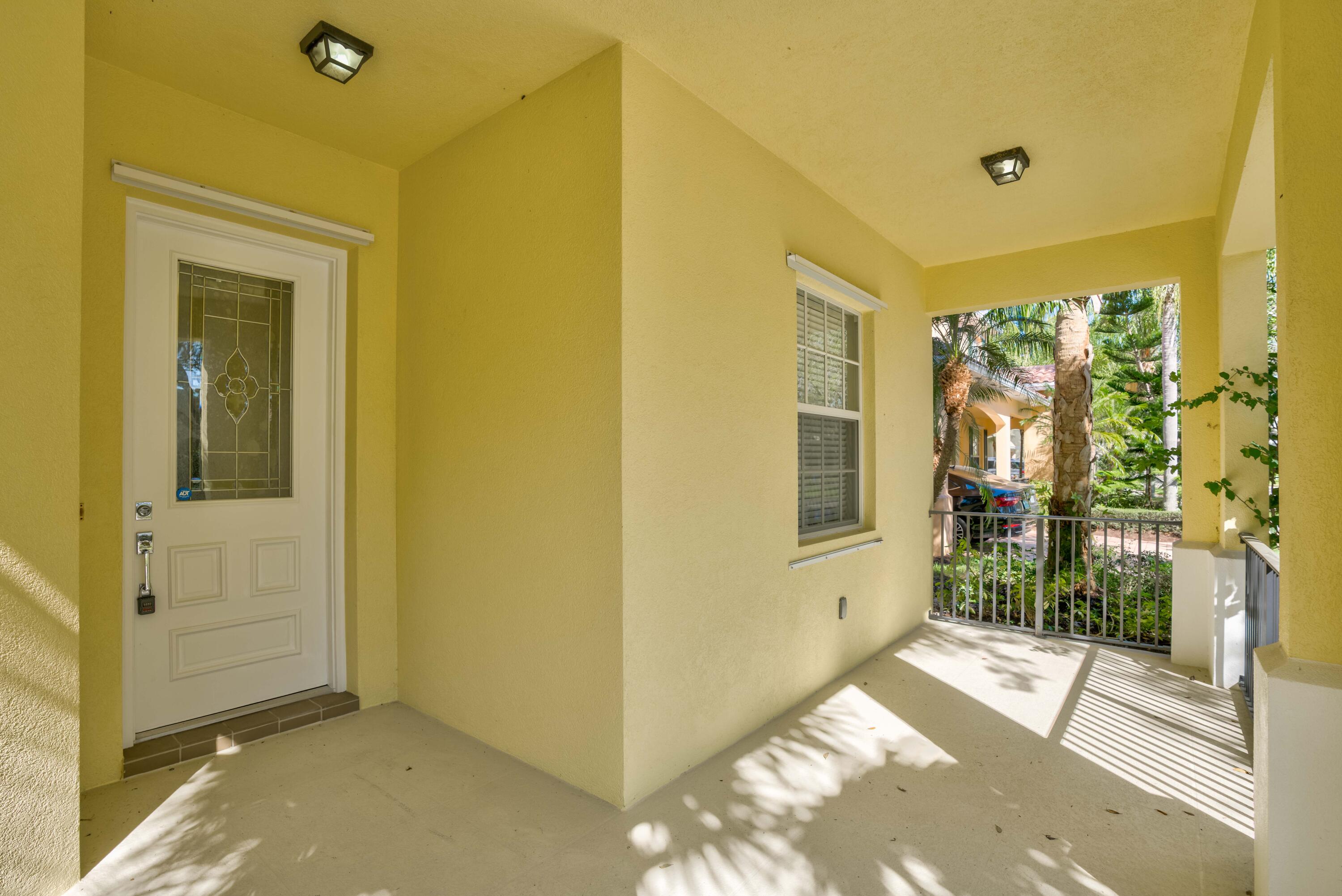 256 San Remo Drive Jupiter, FL 33458 - Photo 16 of 46 a view of a porch with a door