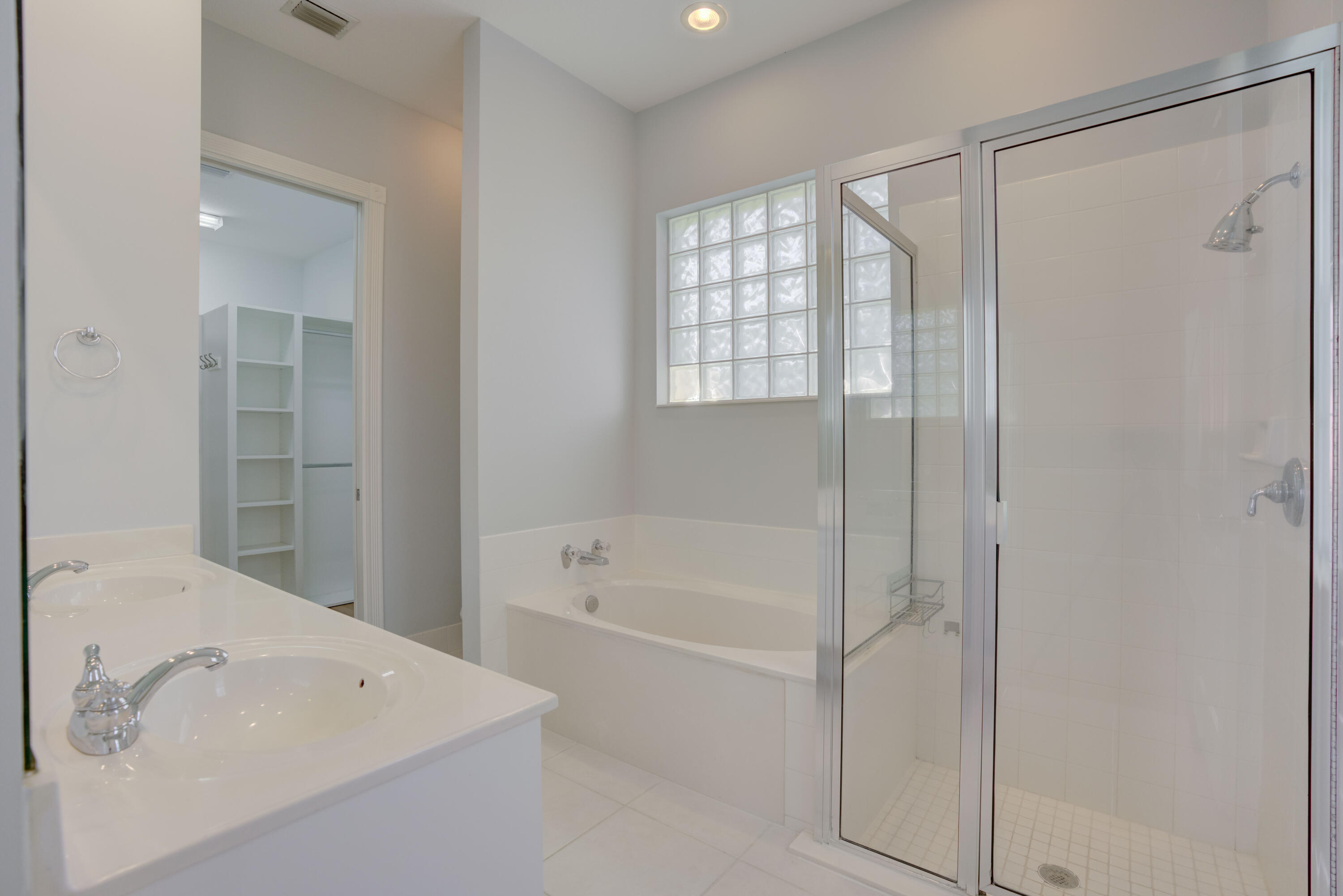 256 San Remo Drive Jupiter, FL 33458 - Photo 3 of 46 a bathroom with a bathtub and a shower