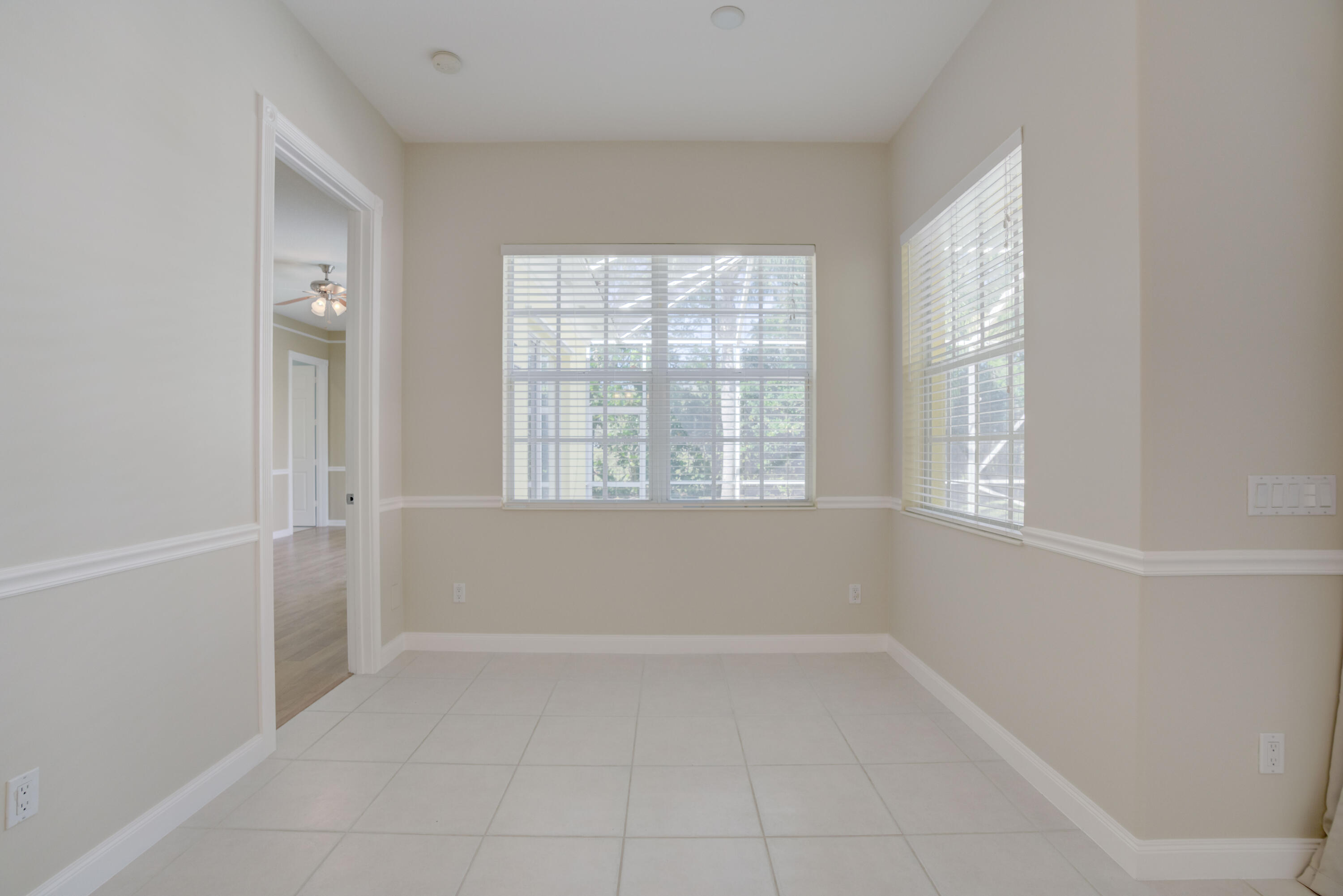 256 San Remo Drive Jupiter, FL 33458 - Photo 36 of 46 an empty room with windows