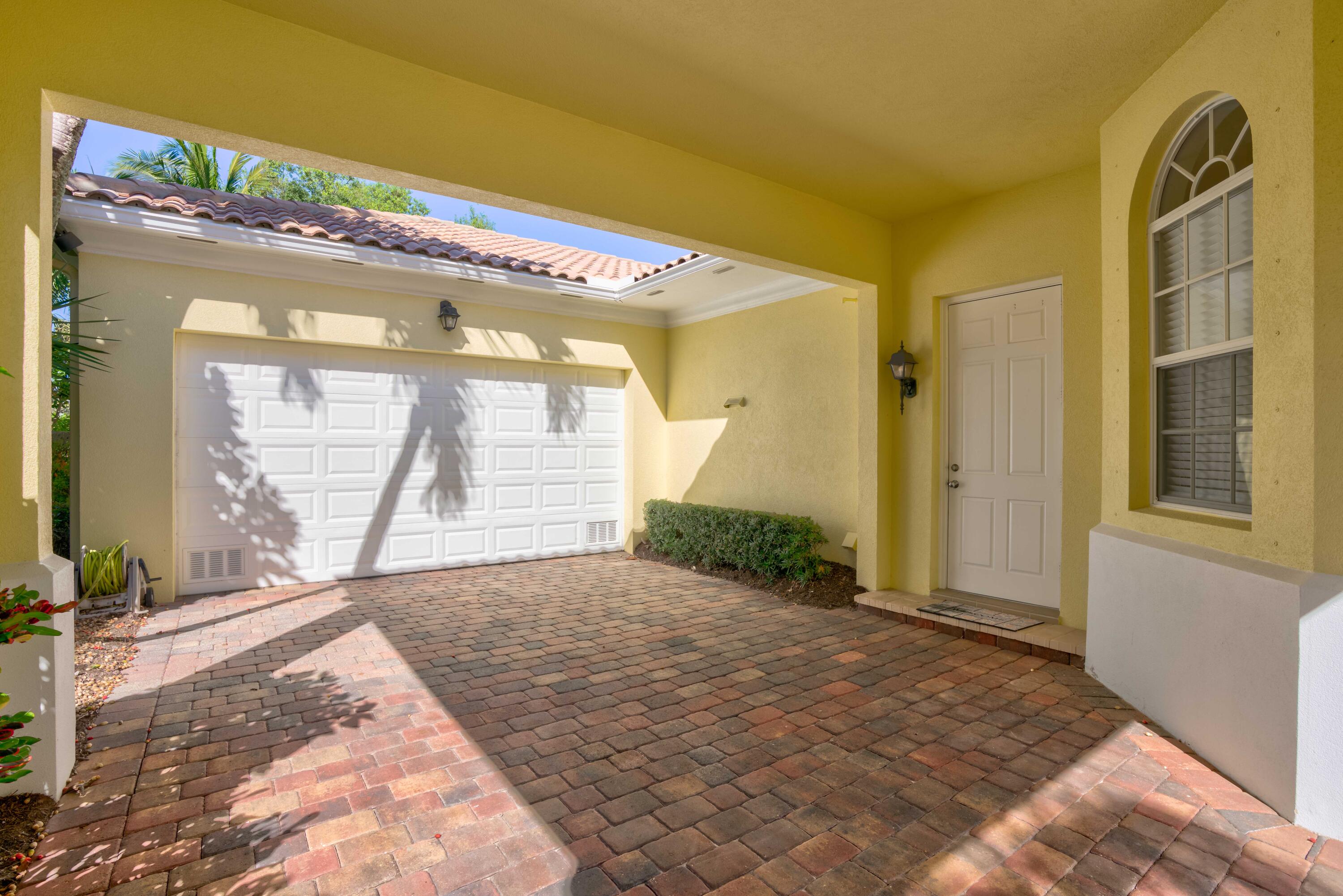 256 San Remo Drive Jupiter, FL 33458 - Photo 4 of 46 a view of entryway front of house