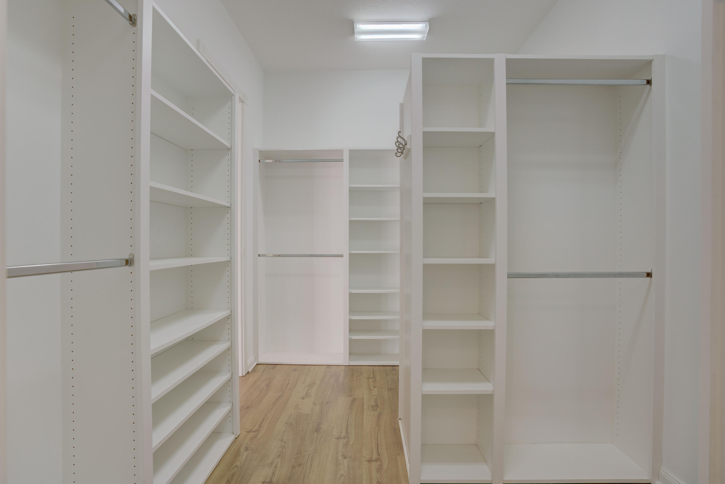 256 San Remo Drive Jupiter, FL 33458 - Photo 7 of 46 a view of walk in closet with empty racks