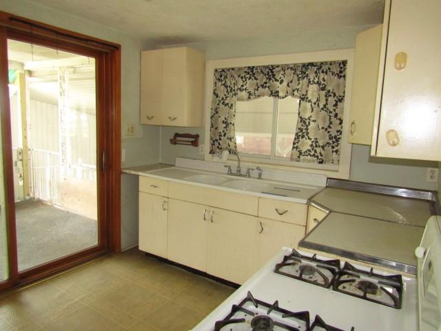 48 Locust Street Ellsworth, PA 15314 - Photo 13 of 26 a bathroom with a sink and a mirror