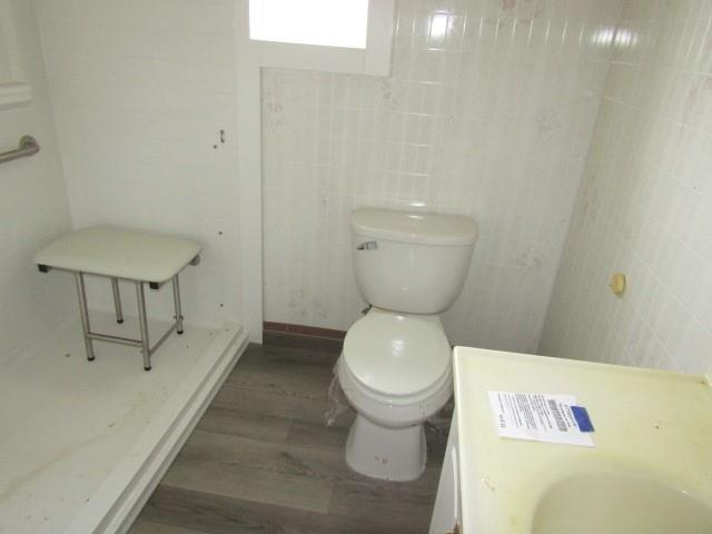48 Locust Street Ellsworth, PA 15314 - Photo 24 of 26 a bathroom with a toilet and a sink