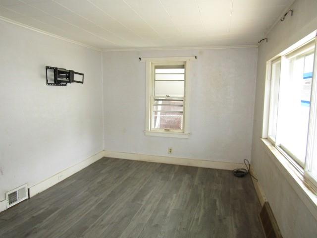 48 Locust Street Ellsworth, PA 15314 - Photo 7 of 26 an empty room with wooden floor and windows