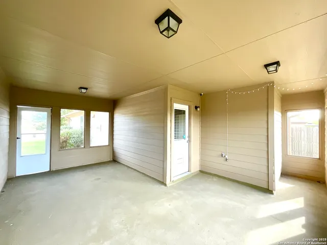 a view of an empty room with a window