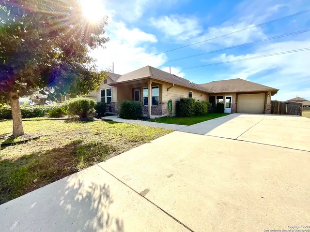 a view of house with yard