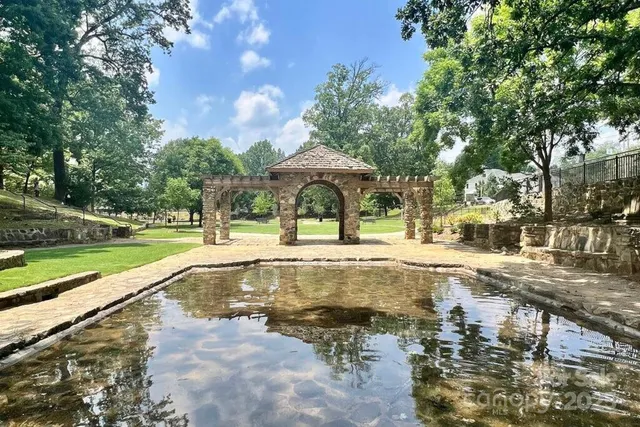 a view of a swimming pool with a patio