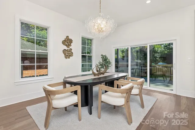 a dining room with furniture and a window