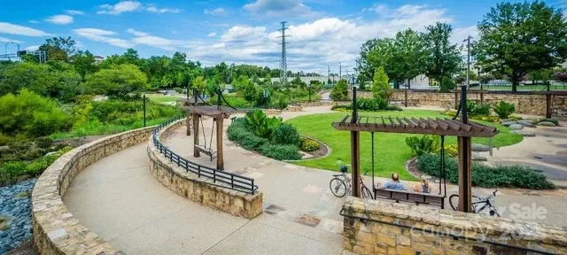 a view of a house with a yard and a garden
