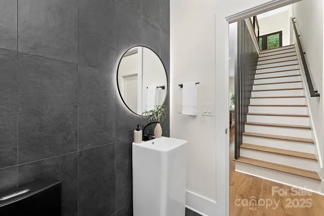 a bathroom with a sink a mirror and a window