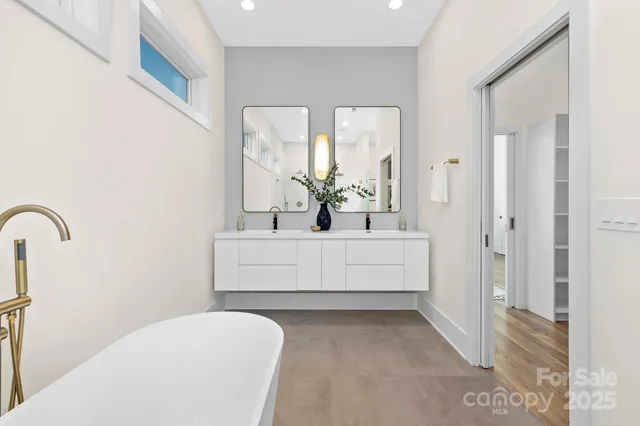 a bathroom with a bathtub and a sink