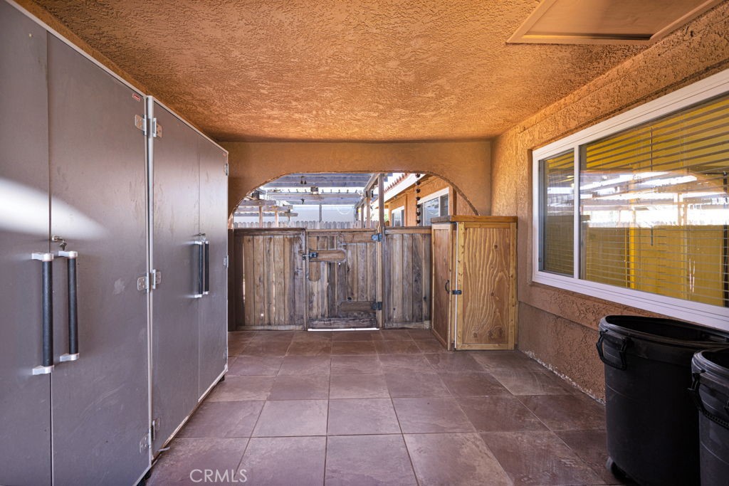9072 Green Road Pinon Hills, CA 92372 - Photo 49 of 70 breezeway between house & detached garage (converted)